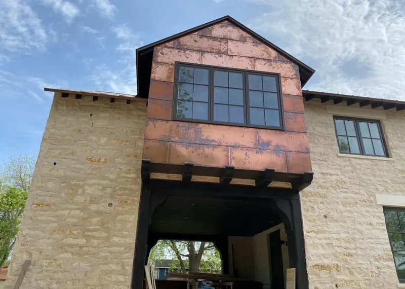 Copper metal panel facade on a stone building for Skylight Installation in Santa Clarita