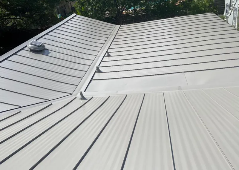 Solar attic fan installed on a metal roof for Roof Ventilation in Santa Clarita